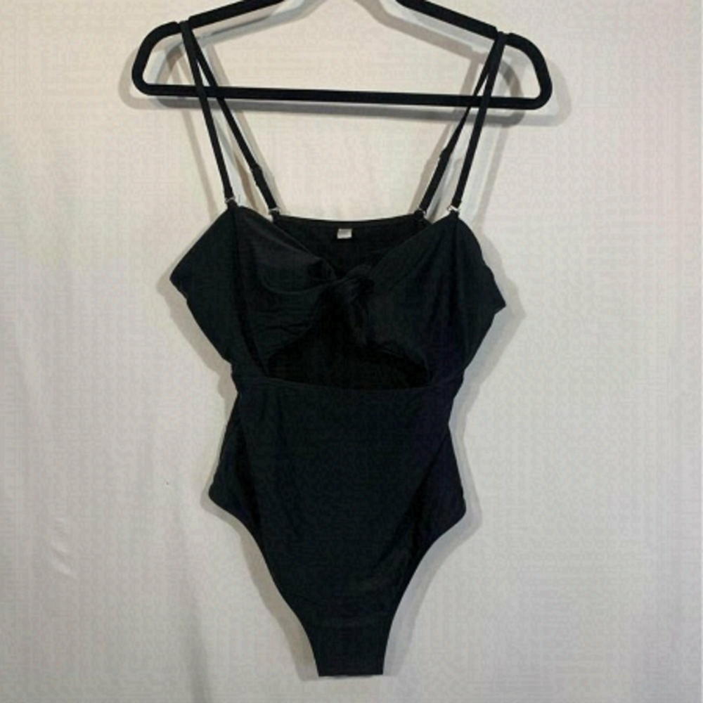 WOMAN’S one piece bathing suit. Size XL. Black. Cute cut out. Bow is adjustable.